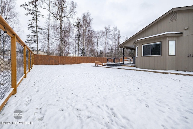 view of yard covered in snow