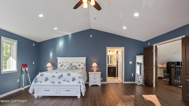 bedroom featuring dark hardwood / wood-style flooring, vaulted ceiling, ceiling fan, and ensuite bath