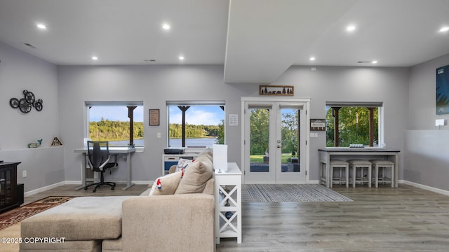 living room with hardwood / wood-style floors and french doors