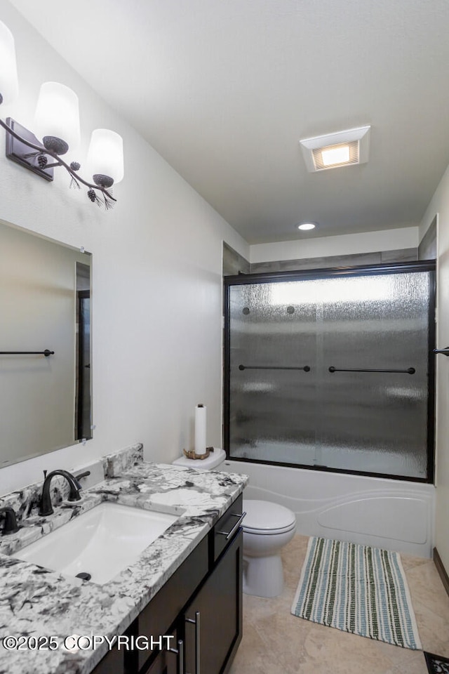 full bathroom featuring enclosed tub / shower combo, vanity, toilet, and tile patterned floors