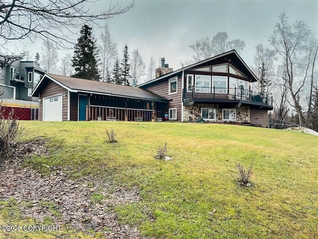 rear view of property with a lawn