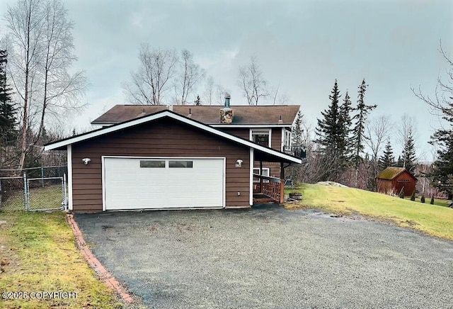 view of front of property with a garage and a front yard