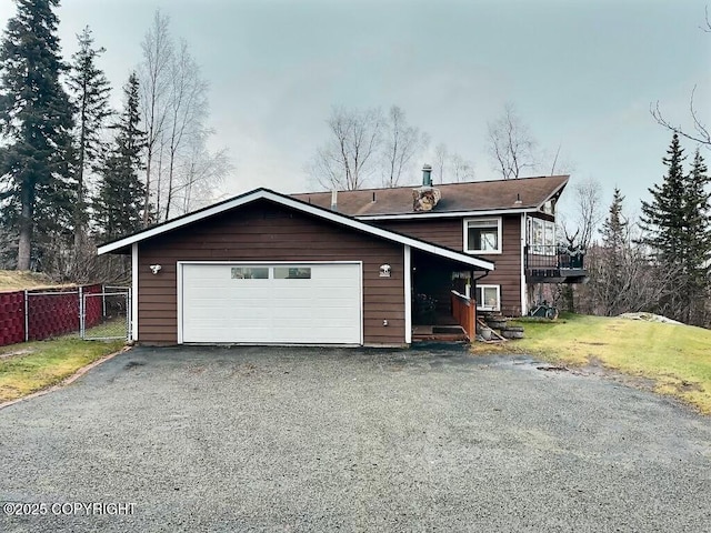 view of front facade featuring a garage and a front yard