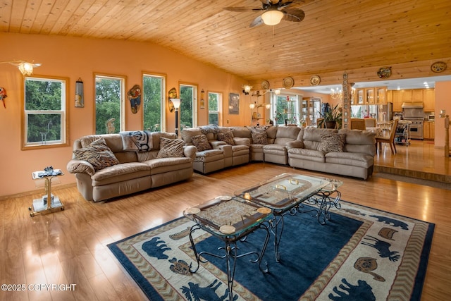 living room featuring wood ceiling, lofted ceiling, a wealth of natural light, and light wood-type flooring