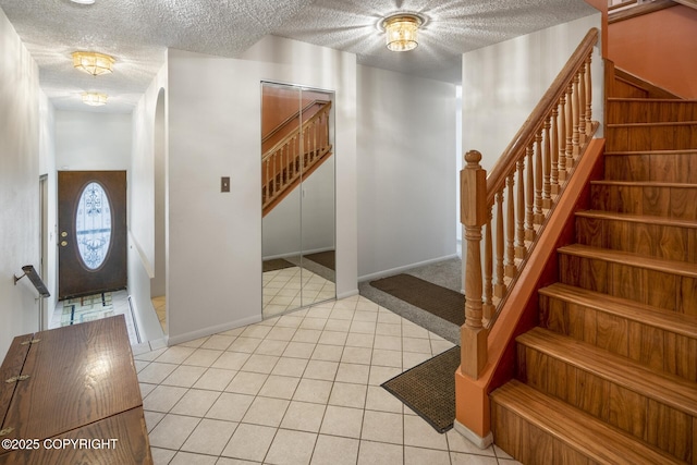 entryway with light tile patterned floors