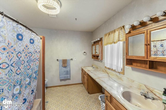 bathroom featuring vanity, toilet, and a shower with shower curtain