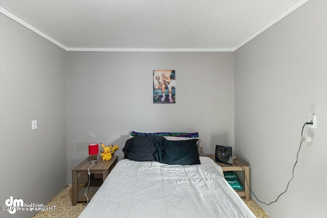 bedroom with crown molding and a textured ceiling