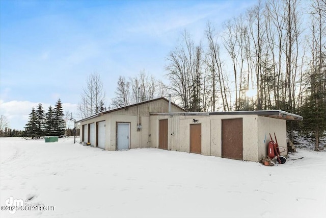 view of snow covered garage