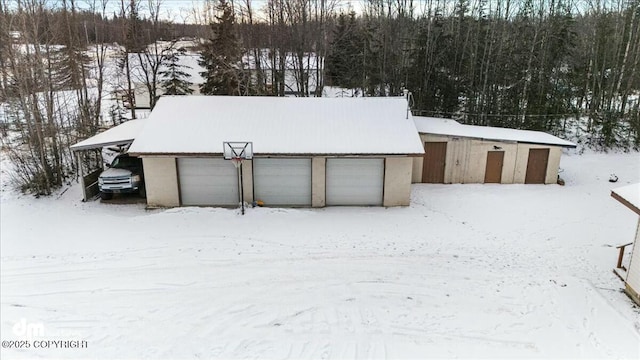 view of snow covered garage