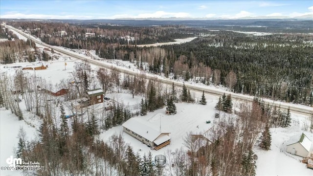 snowy aerial view with a mountain view