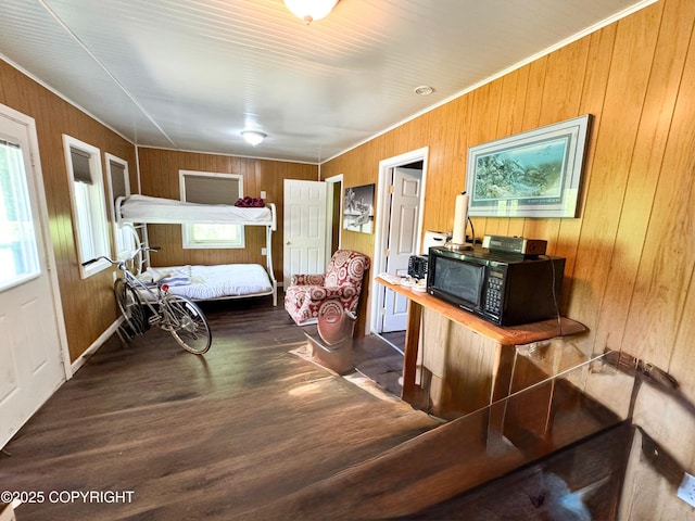 9218 N Erica Dr, Willow, AK 99688 - bedroom featuring wood finished floors, wood walls, and ornamental molding