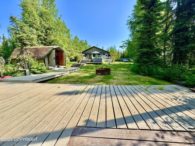 9218 N Erica Dr, Willow, AK 99688 - wooden terrace with a lawn and an outbuilding