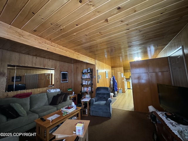 living room featuring beamed ceiling, carpet flooring, wooden ceiling, and wood walls