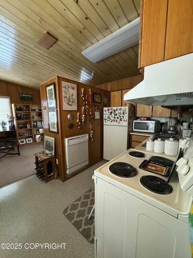 kitchen with wooden walls, light colored carpet, wood ceiling, and white appliances