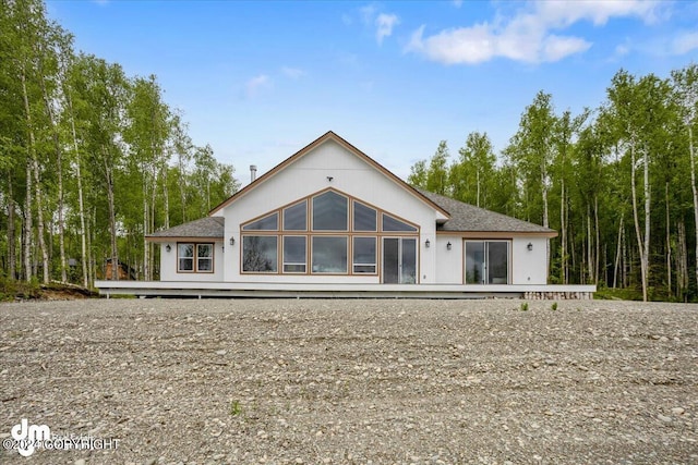 rear view of house with a wooden deck