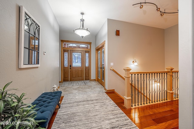 foyer entrance with hardwood / wood-style flooring