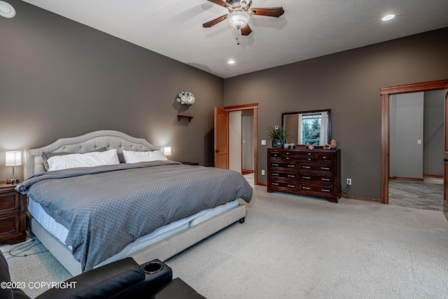 bedroom with ceiling fan and light colored carpet