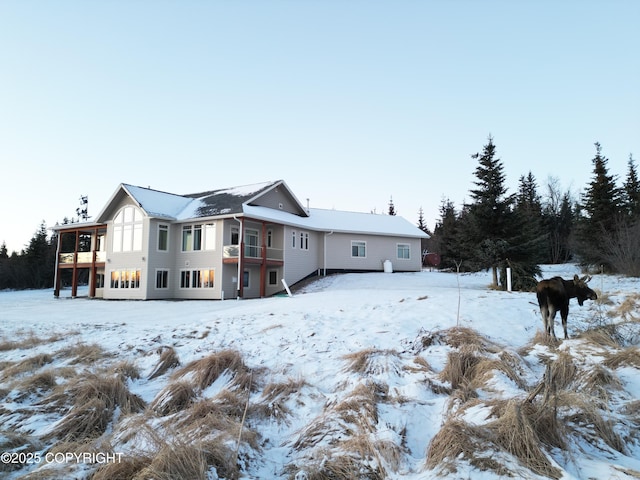 view of snow covered house