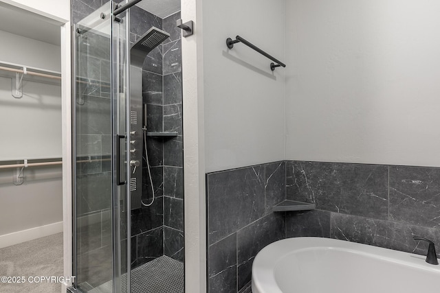 bathroom with shower with separate bathtub