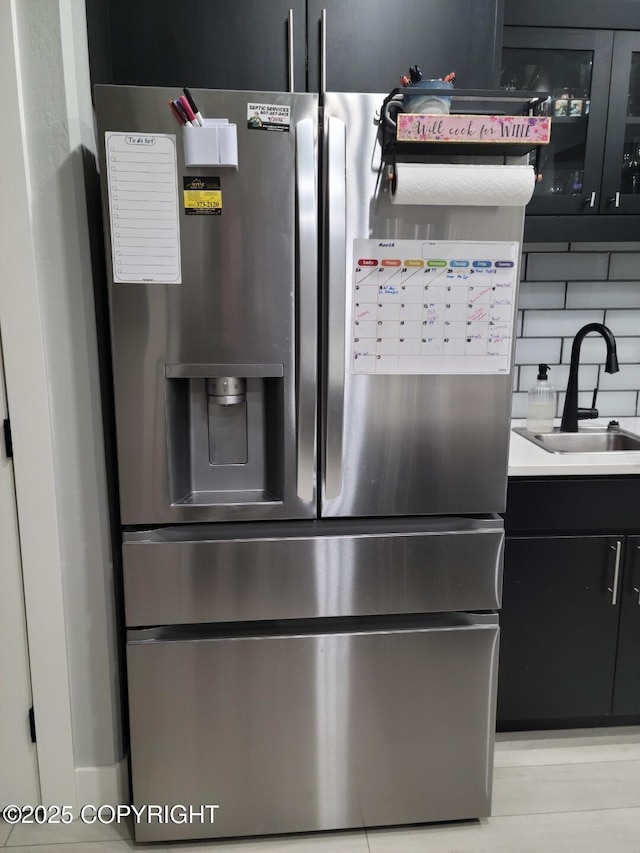 interior details with stainless steel refrigerator with ice dispenser and sink