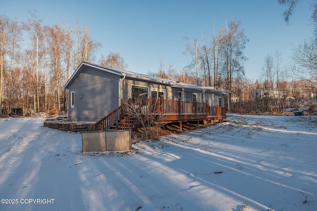 view of front of property featuring a wooden deck