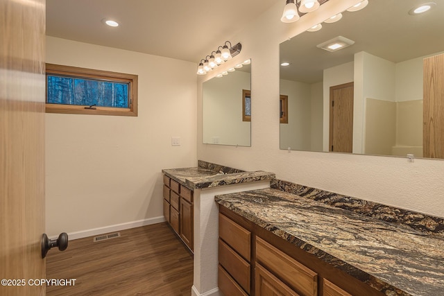 bathroom featuring wood-type flooring and vanity