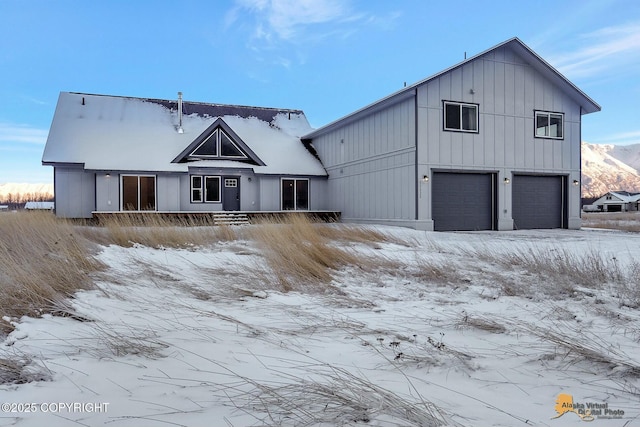 modern farmhouse style home with a garage and board and batten siding