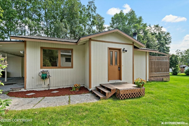 view of outbuilding featuring a yard