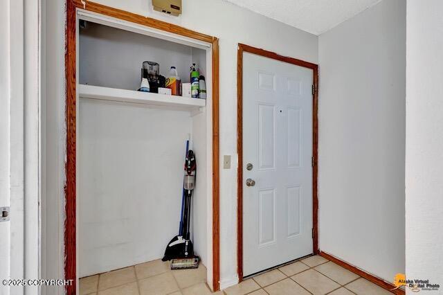 7750 Boundary Ave # A3, Anchorage, AK 99504 - entryway with light tile patterned floors
