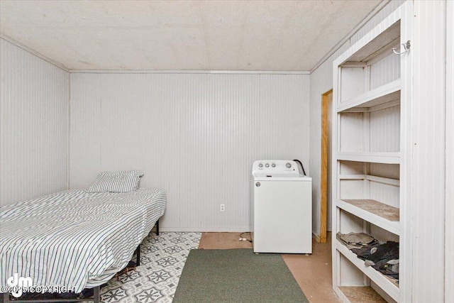 bedroom featuring washer / dryer