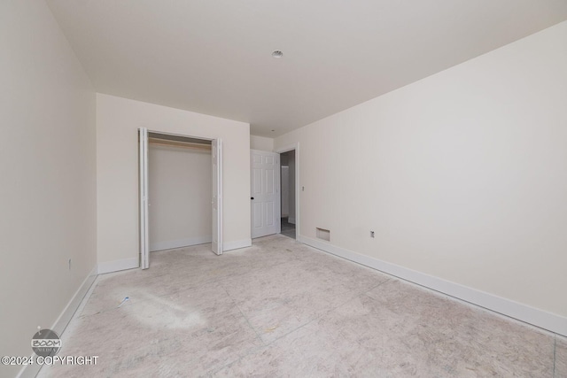 unfurnished bedroom with a closet