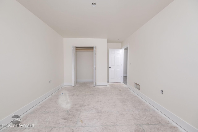 unfurnished bedroom featuring a closet