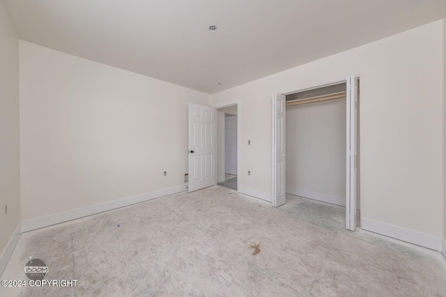 unfurnished bedroom with a closet