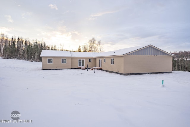 view of snow covered house