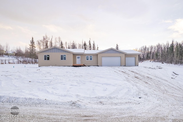 single story home with a garage