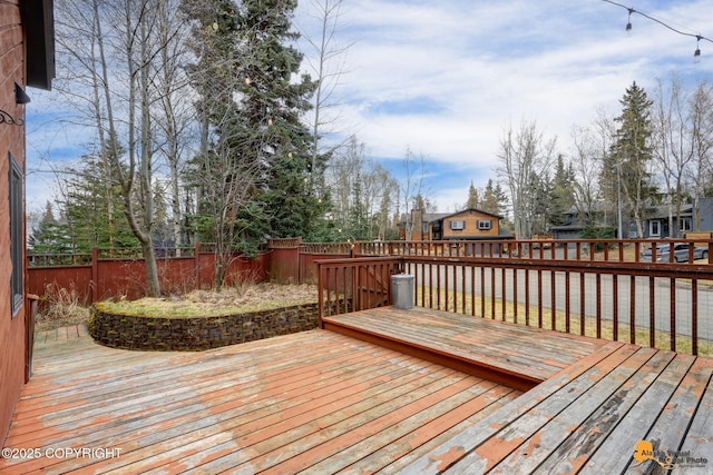 deck with a fenced backyard