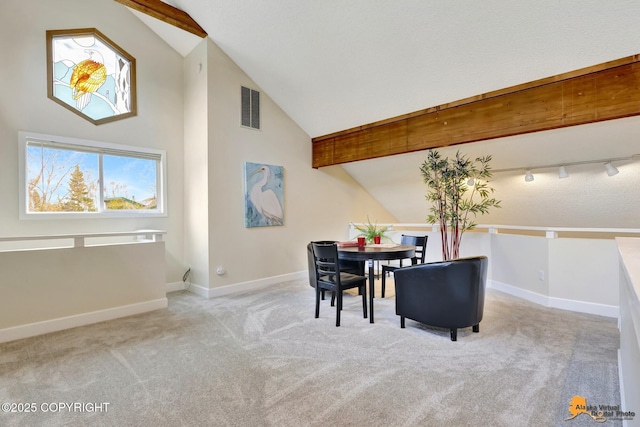 dining room with baseboards, visible vents, carpet, and high vaulted ceiling