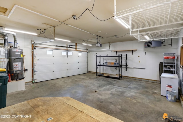 garage featuring a garage door opener and water heater