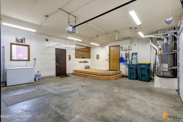 garage featuring a garage door opener, heating unit, and refrigerator