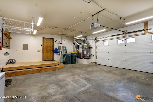garage featuring a garage door opener, heating unit, and electric panel