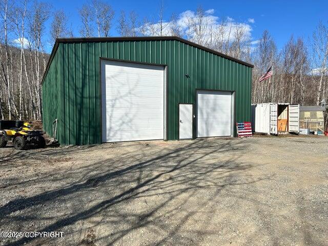 view of outbuilding with a garage