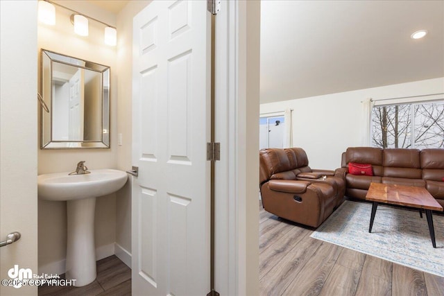 bathroom featuring hardwood / wood-style flooring and sink