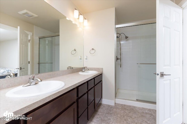 bathroom with vanity and an enclosed shower