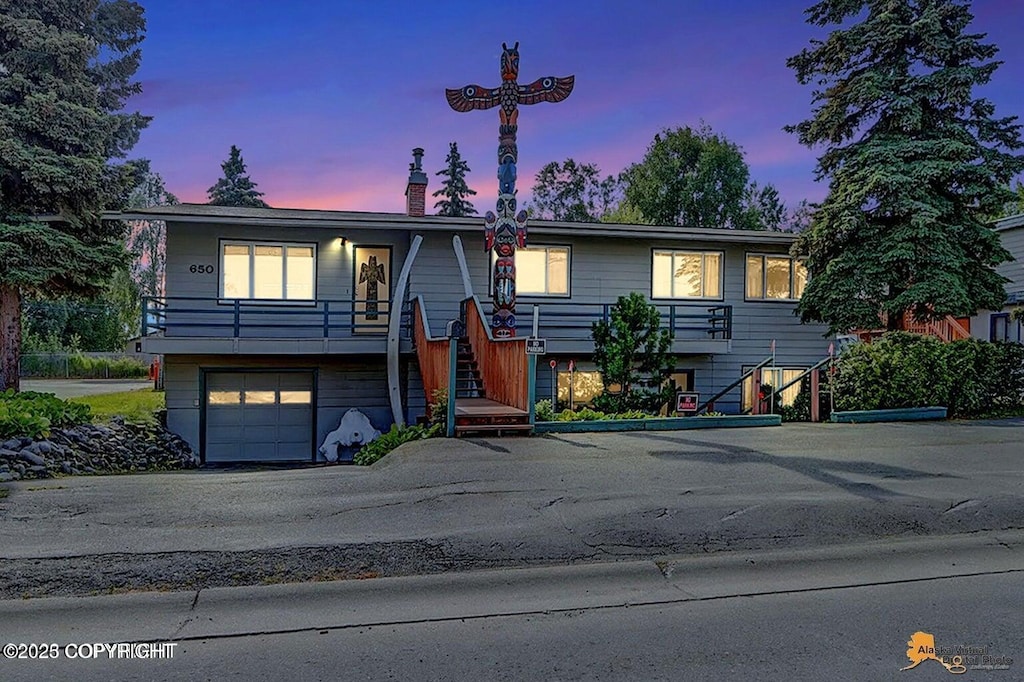 raised ranch featuring a garage