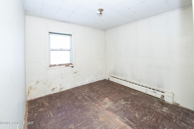 empty room featuring a baseboard radiator