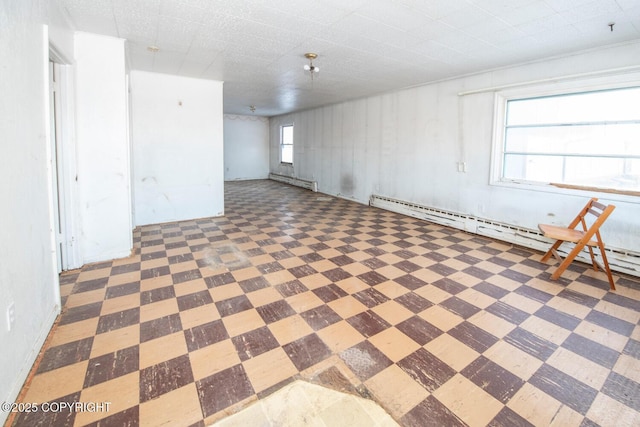 basement featuring baseboard heating