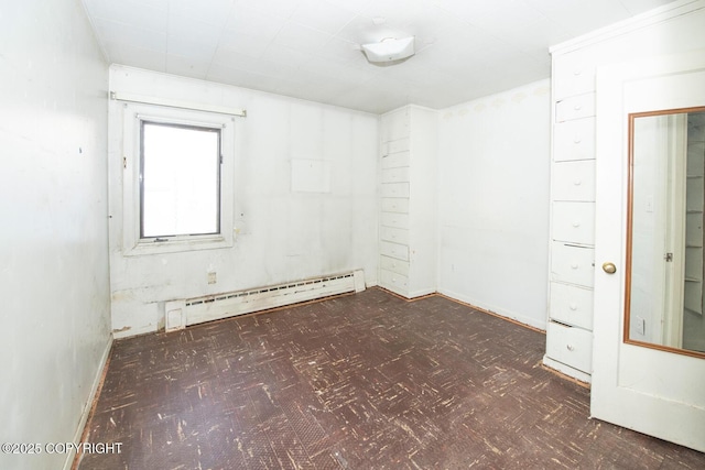 unfurnished room with a baseboard radiator