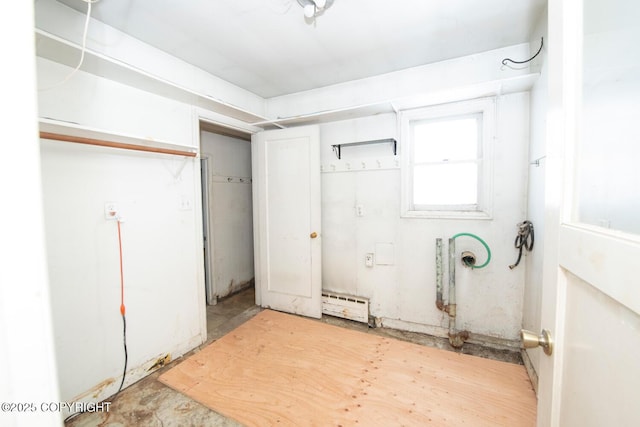 basement with a baseboard heating unit