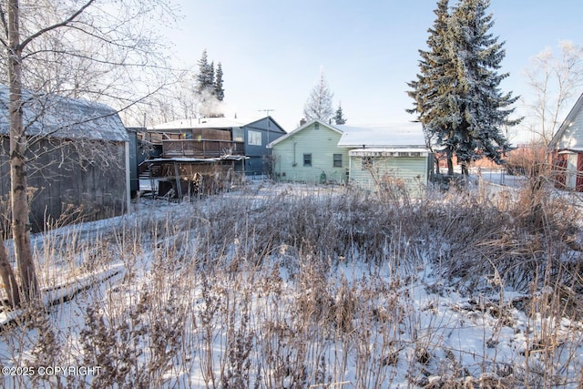 view of snow covered house