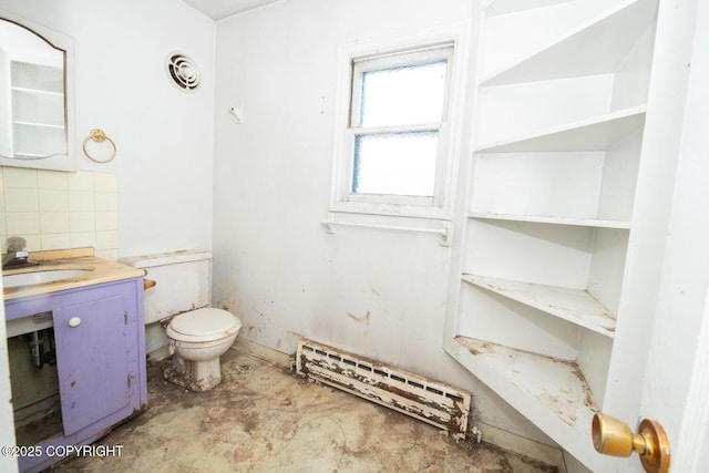 bathroom with toilet, concrete flooring, baseboard heating, vanity, and decorative backsplash